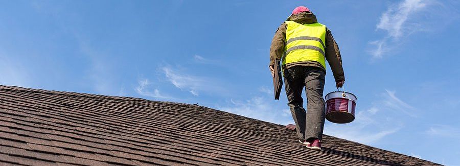 man working on roof